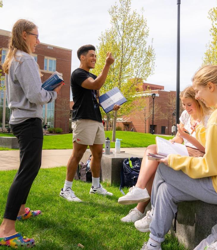 students outdoors for math class, laughing 